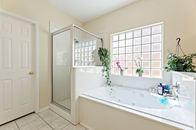 bathroom with shower with separate bathtub, a healthy amount of sunlight, and tile patterned floors