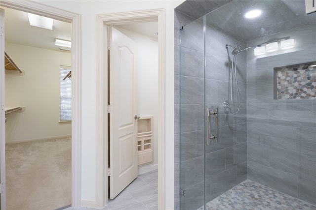 bathroom with tile patterned floors and an enclosed shower