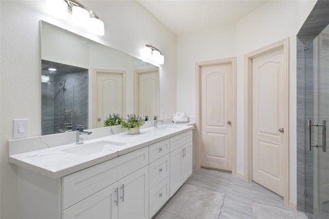 bathroom featuring vanity and a shower with shower door