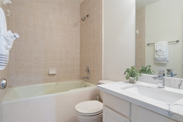 full bathroom with vanity, toilet, and tiled shower / bath