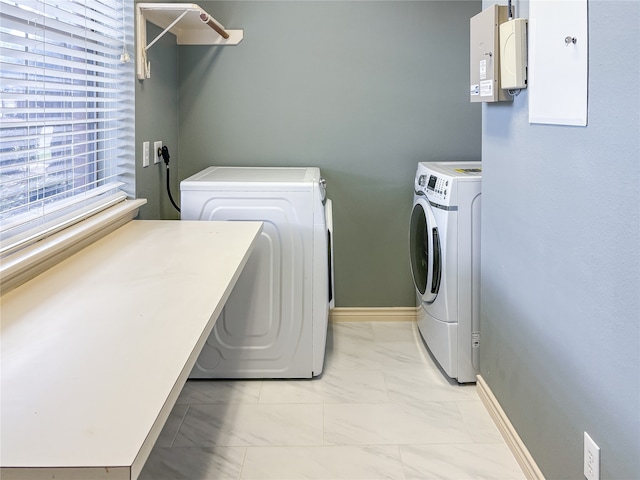 clothes washing area with washer and dryer