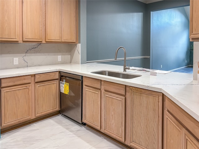 kitchen with stainless steel dishwasher, light stone countertops, sink, and light tile patterned floors