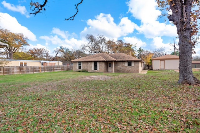 back of house featuring a yard