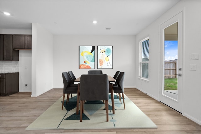 dining space featuring light wood-type flooring