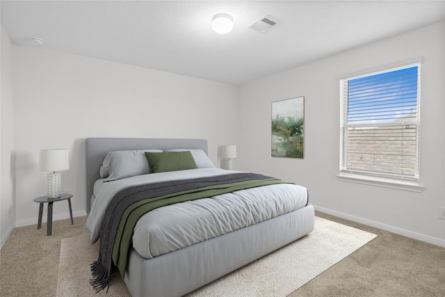 bedroom with light carpet