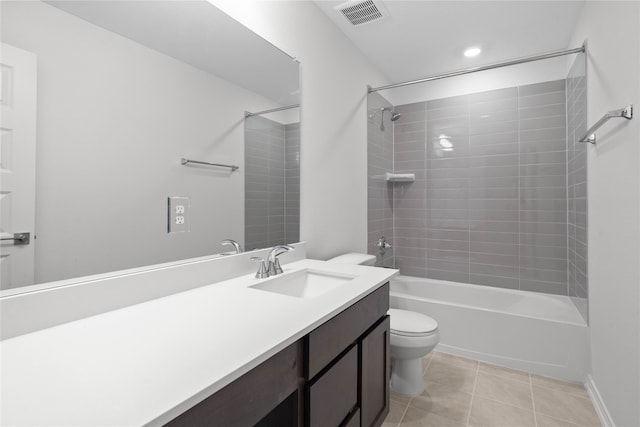 full bathroom with toilet, vanity, tiled shower / bath combo, and tile patterned floors