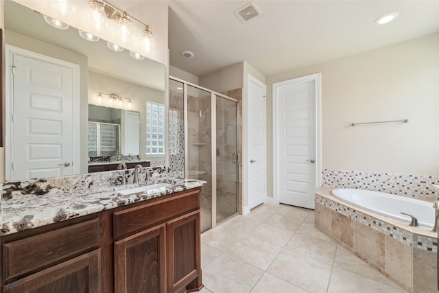 bathroom with separate shower and tub, tile patterned flooring, and vanity