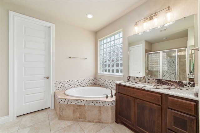 bathroom featuring separate shower and tub, tile patterned floors, and vanity