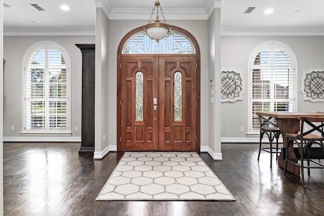 entryway featuring ornamental molding, plenty of natural light, and dark hardwood / wood-style floors