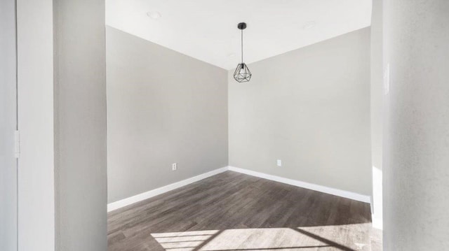 empty room featuring dark wood-type flooring