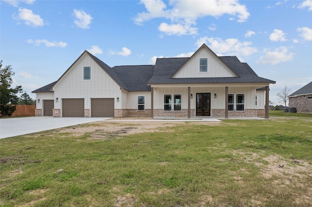 modern inspired farmhouse with a porch, a front lawn, and a garage