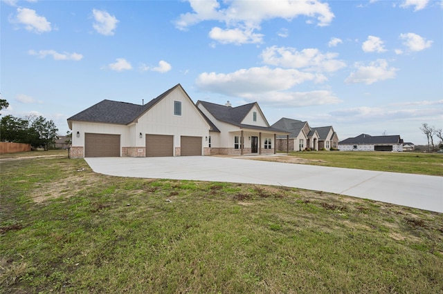 view of front of home featuring a front lawn and a garage