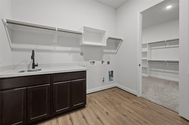 laundry room featuring hookup for an electric dryer, sink, cabinets, gas dryer hookup, and washer hookup