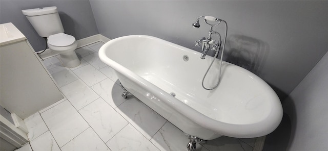 bathroom with tile patterned flooring, toilet, and a tub to relax in