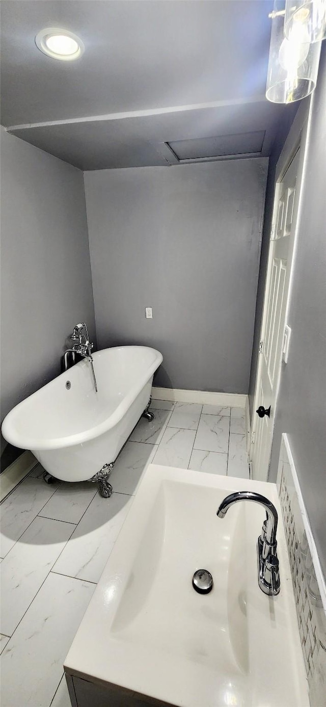 bathroom featuring a bathing tub and sink