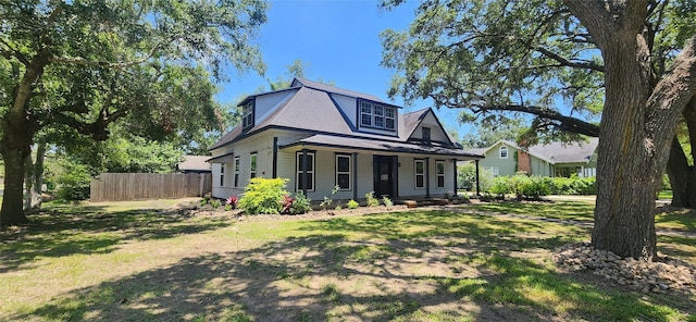 view of front of home with a porch and a front lawn