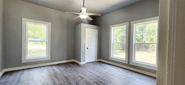 unfurnished bedroom featuring hardwood / wood-style floors and ceiling fan