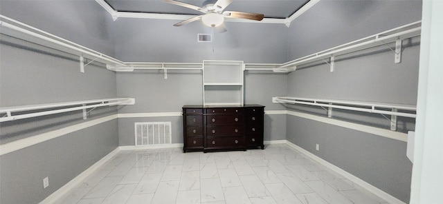 walk in closet featuring ceiling fan