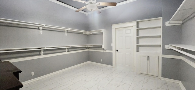 walk in closet with ceiling fan