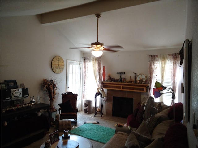 carpeted living room with plenty of natural light, lofted ceiling with beams, a fireplace, and ceiling fan