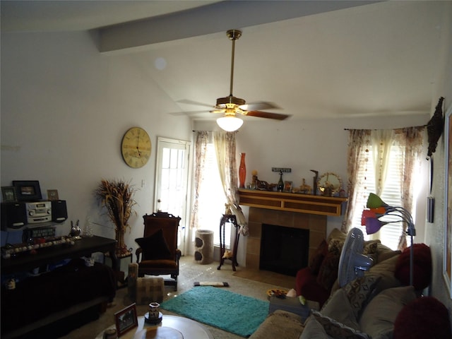 carpeted living room with ceiling fan, a fireplace, lofted ceiling with beams, and plenty of natural light