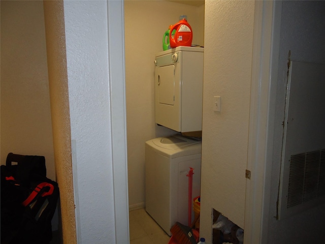 washroom with stacked washer and clothes dryer