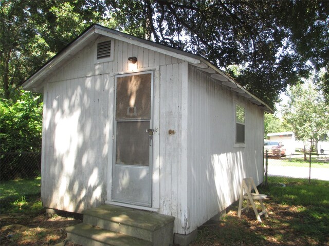 606 E Humble St, Baytown, TX 77520 - view of outbuilding with an outbuilding, entry steps, and fence