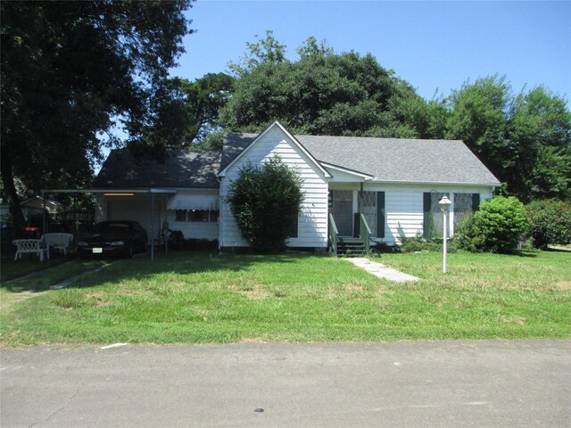 606 E Humble St, Baytown, TX 77520 - ranch-style house with an attached carport, entry steps, and a front yard