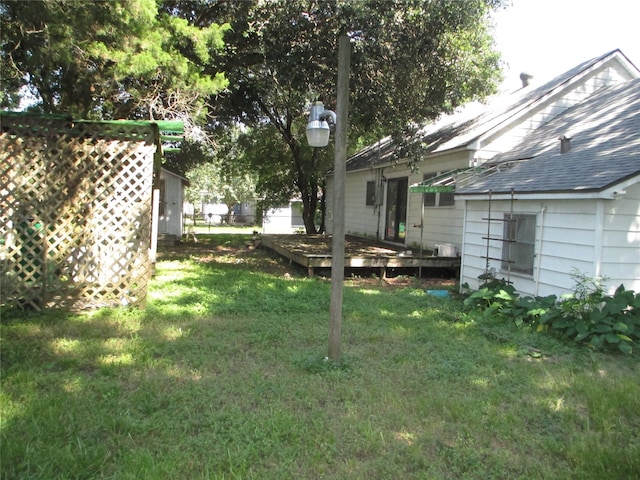 606 E Humble St, Baytown, TX 77520 - view of yard with a deck