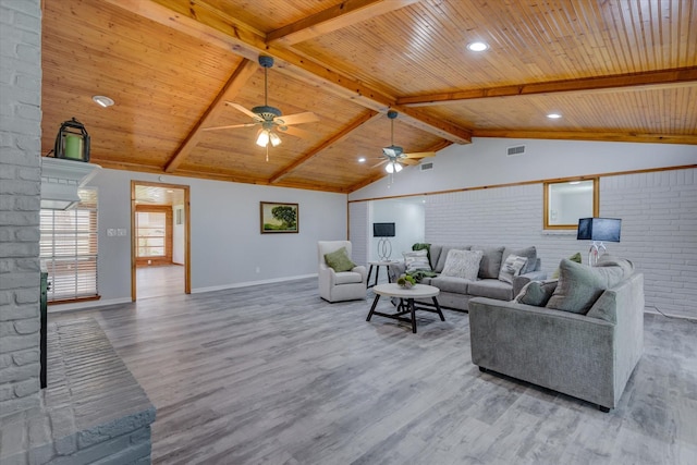 living room featuring vaulted ceiling with beams, wood ceiling, and brick wall