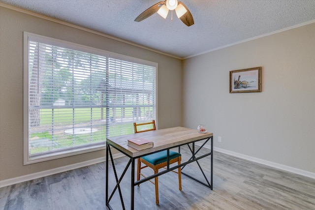 office area with a textured ceiling, ceiling fan, plenty of natural light, and hardwood / wood-style floors