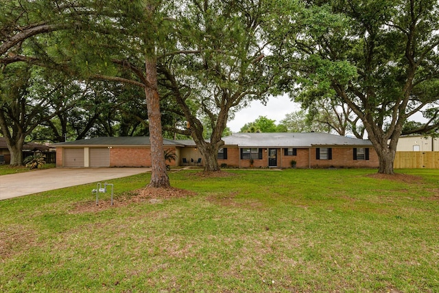 ranch-style house with a garage and a front yard