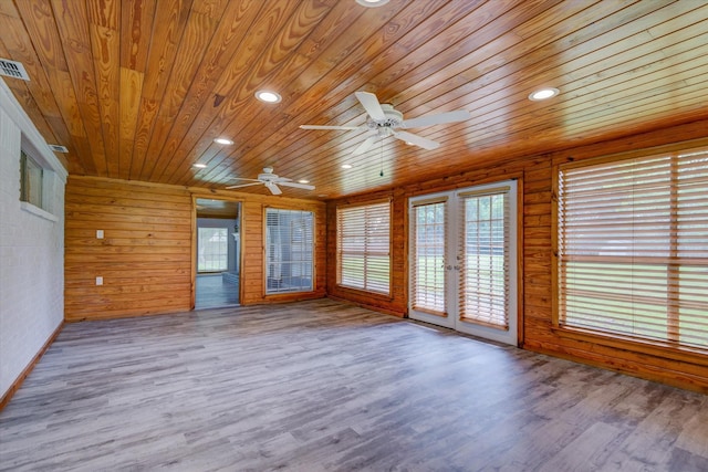 interior space featuring ceiling fan, french doors, and wood ceiling