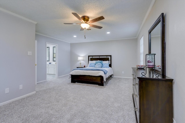 carpeted bedroom featuring ceiling fan, a textured ceiling, ensuite bathroom, and ornamental molding