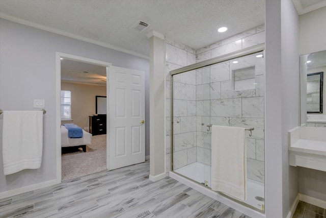 bathroom with a shower with shower door, crown molding, a textured ceiling, and hardwood / wood-style flooring