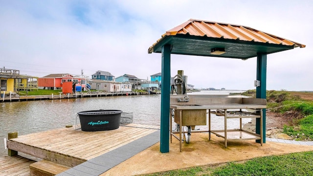 dock area with a water view