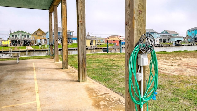 view of jungle gym featuring a yard and a water view