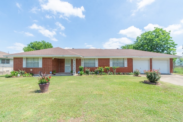 ranch-style house with a front yard and a garage