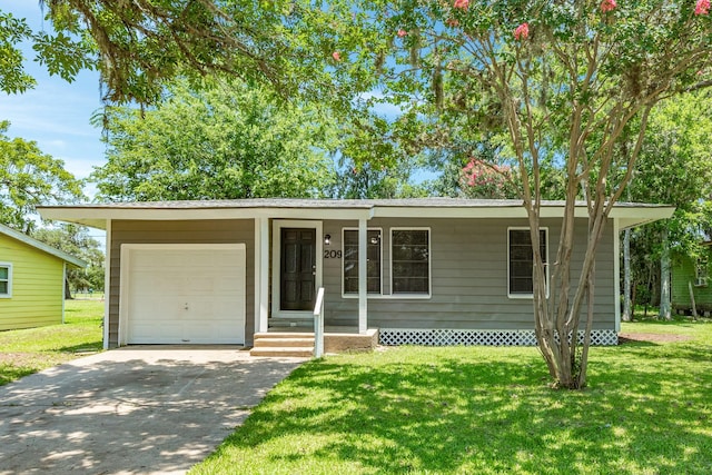 ranch-style house featuring a garage and a front lawn