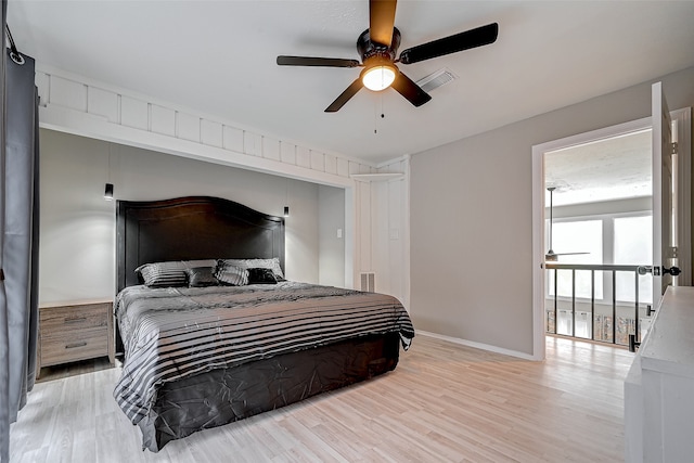 bedroom with light hardwood / wood-style floors and ceiling fan