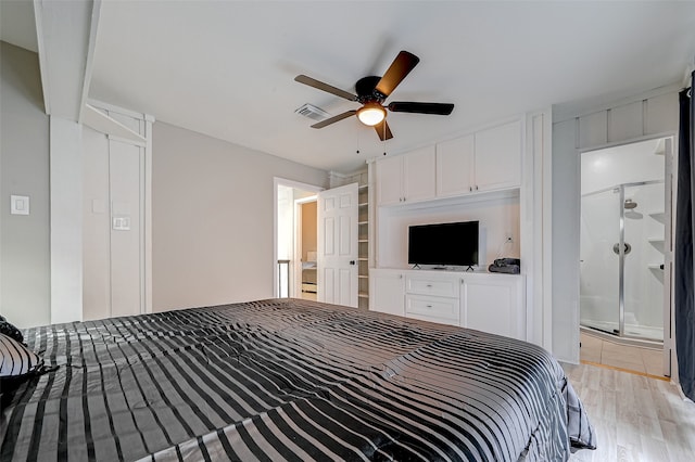 unfurnished bedroom with ceiling fan, ensuite bath, and light hardwood / wood-style flooring