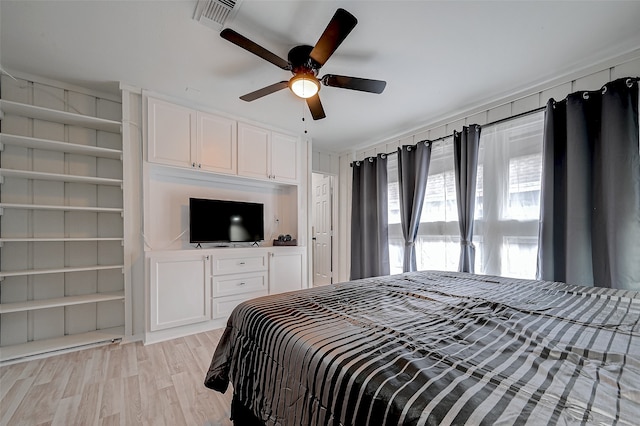 bedroom with ceiling fan and light hardwood / wood-style floors