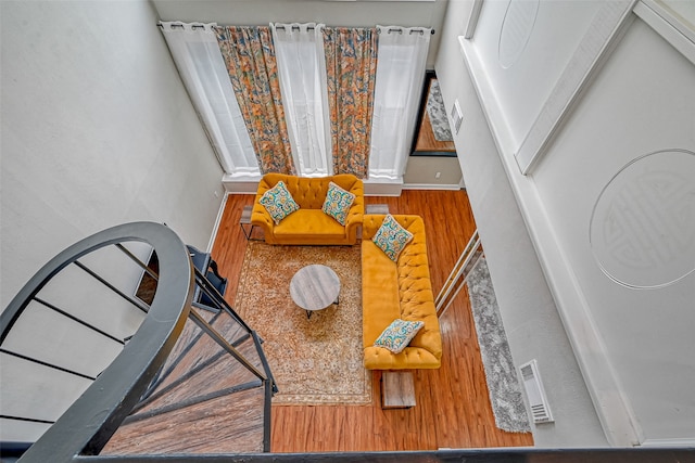 stairs featuring hardwood / wood-style floors