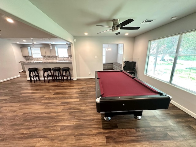 recreation room with ceiling fan with notable chandelier, pool table, a wealth of natural light, and dark hardwood / wood-style floors