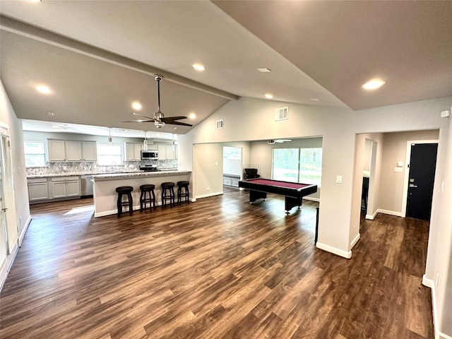 recreation room featuring pool table, dark hardwood / wood-style floors, a healthy amount of sunlight, and vaulted ceiling with beams