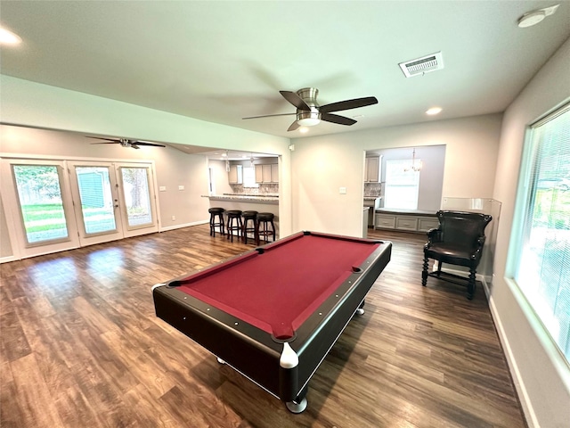 playroom with ceiling fan with notable chandelier, billiards, and dark wood-type flooring