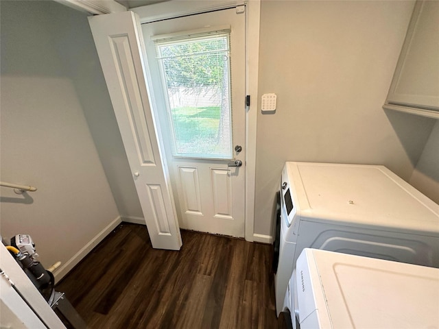 laundry room with independent washer and dryer and dark hardwood / wood-style flooring