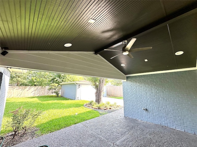 view of patio featuring a storage unit and ceiling fan