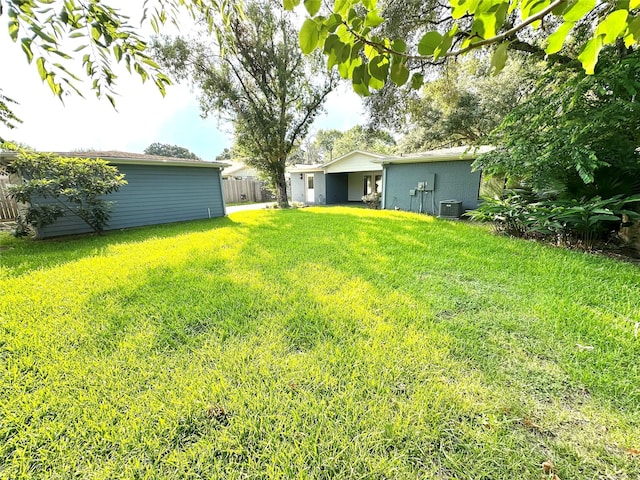 view of yard with central AC