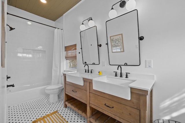 full bathroom with tile floors, shower / bath combination with curtain, large vanity, and toilet